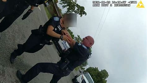 Florida police sergeant grabbing fellow officer by her throat