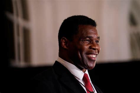 Herschel Walker, who criticizes absentee fathers, acknowledges second son