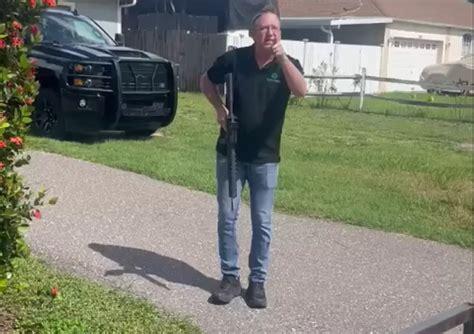 Florida man charged after reports he pointed assault rifle at Black landscaper