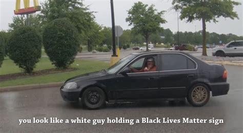 White kid gets threatened and insulted for holding Black Lives Matter sign in Arkansas and he was forced to leave a Walmart parking lot [VIDEO]