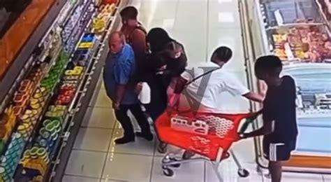 Family of three walks up to a woman in a grocery store, blocked her, and tried to steal her wallet right off her waist [VIDEO]