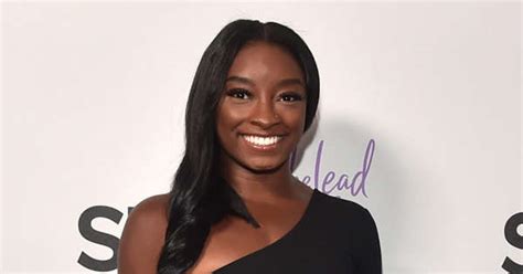 Simone Biles’ Cozy Night-In with Fiancé Jonathan Owens in Red-Hot Dress and Matching Fuzzy Slides